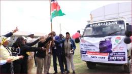 Former Trade CS Moses Kuria flagging off a truck carrying cooking gas cylinders in Ol Kalou.